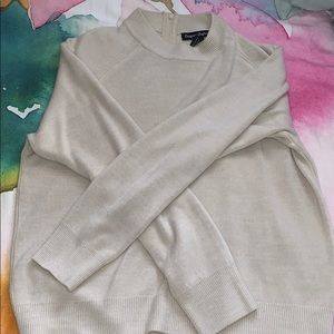 tan/beige sweater with zipper on back, high neck